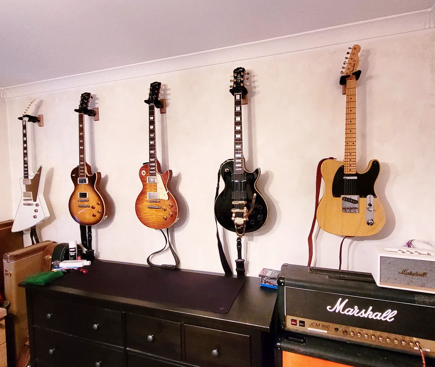 Guitar collection on the wall... 
Left to right 

@Gibson @officiallzzyhale #LzzyHaleExplorer

@Gibson #1960 #LesPaulClassic

@gibsoncustom #Reissue59 

@epiphone #LesPaulCustom @bigsby @emgpickups @vibramate 

@fender #AVRI #1952Telecaster 

And just in shot is my @marshallamps_uk #JCM900 #4100 

All hanging on @herculesstands  special thanks to @stringsandthingsltd for the replacement stand recently. 👍